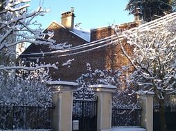 brick wall of a house in the snow