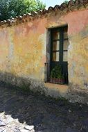 facade of an abandoned house in partial shade