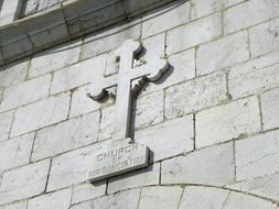 cross on the wall of Nazareth in Israel