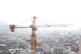 construction crane over the city panorama