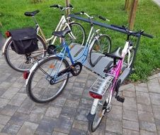 bicycle parking with three city bikes