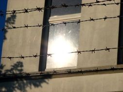 barbed wire on the facade of the building