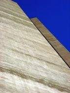 gray wall and blue sky