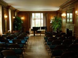 chairs and pianos in the hall