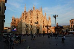 square in front of the cathedral in milan at dusk