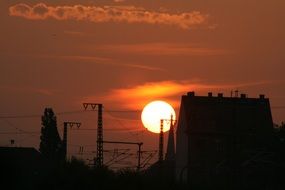 beautiful sunny sunset on the background of the city