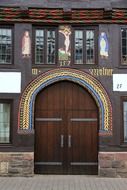 colorful door truss decor with facade figurine
