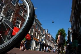 a bicycle wheel on a central city street in Holland