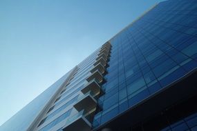 Bottom view of the glass facade of a modern building