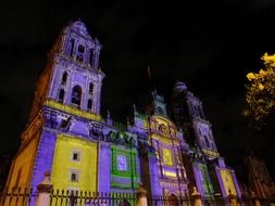Colorful illuminated Mexico City Metropolitan Cathedral at night, Mexico