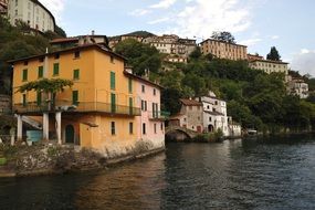 Houses on a mountain lake shore, italy