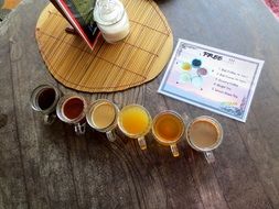 variety of drinks on a wooden table