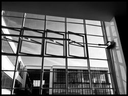 black and white photo of large glass windows at a factory in Dessau