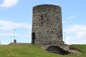 old grey stone round tower