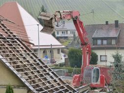 Excavator on the background of buildings