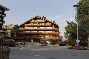 road near a large chalet in the alps