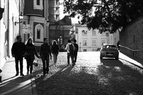 Black and white photo of Walking people on a street