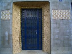 ornate doorway with blue door, paris, france