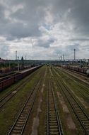 railway beneath cloudy sky