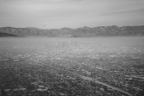 panoramic view of urban architecture in a snowy haze