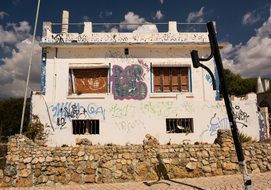 abandoned house with spray paint drawings