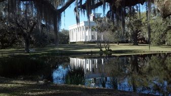 building with columns near the pond
