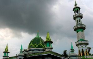 towers on the mosque under the clouds