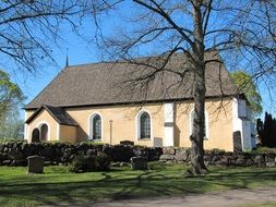 almunge church building with graveyard