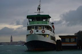 canal waterbus at dusk in venice