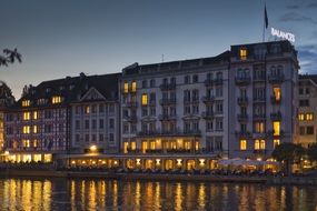 romantic hotel building on a riverside in Lucerne