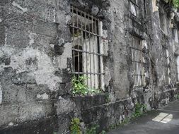 gray wall of a ruined building