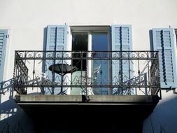 balcony with wrougth iron fence on old building, switzerland, uttwil