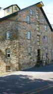 high stone barn in countryside, usa, pennsylvania, amish