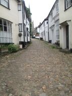 england cobblestone road with houses landscape