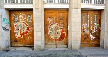 three wooden old doors in the inscriptions