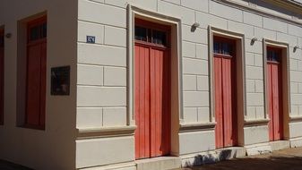 mansion with red wooden doors