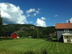 rural house among beautiful nature on a sunny day