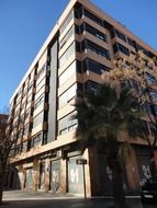 glass facade of a stone building