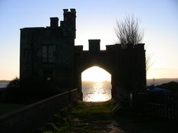 sunset view through the castle arch