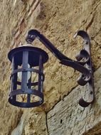 Lamp on the wall of Medieval city of Perouges