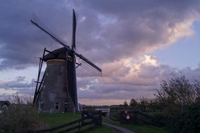 Windmill among the rural landscape in Holland