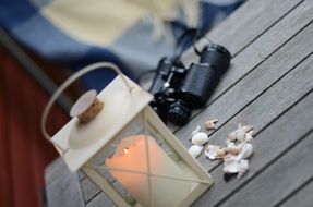 candle on a wooden table at the cottage