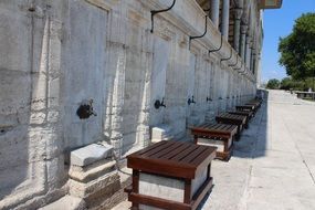 wooden benches near the wall