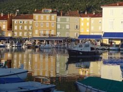 city is reflected in the mediterranean