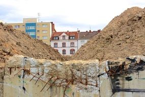 mountains of sand on the background of the house