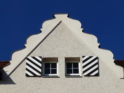 striped shutters on the facade of the building