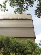 world trade center among the green trees in dallas