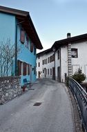 blue and white houses on a narrow street