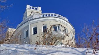 oval building in sunny winter day