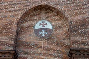 crosses on a brick wall